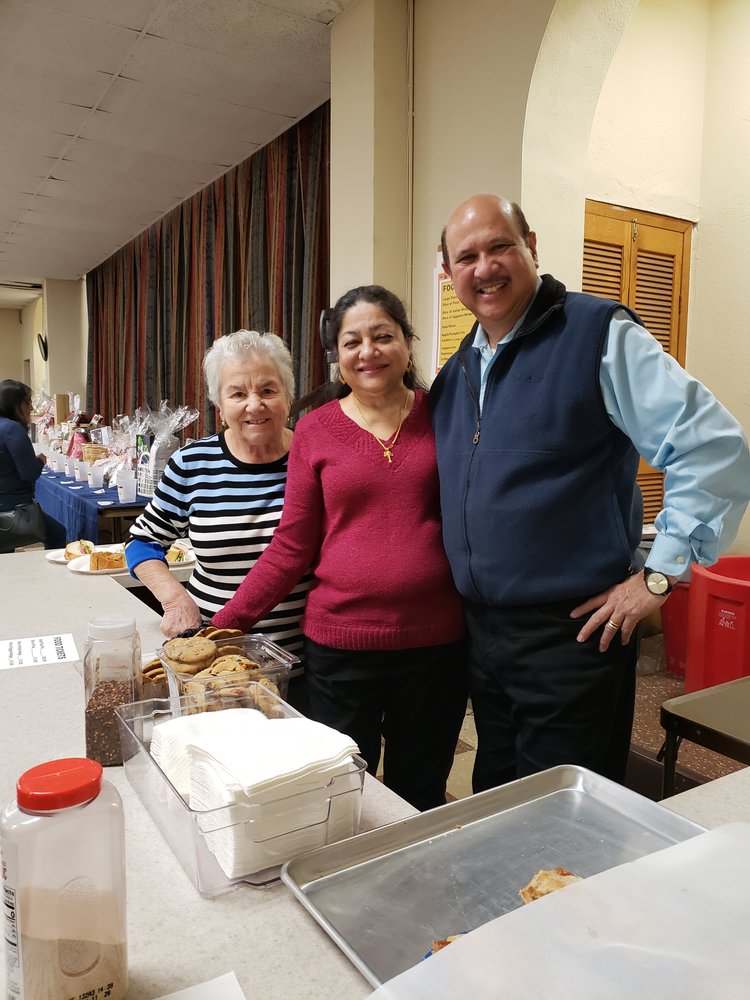 Man and two women sharing a meal