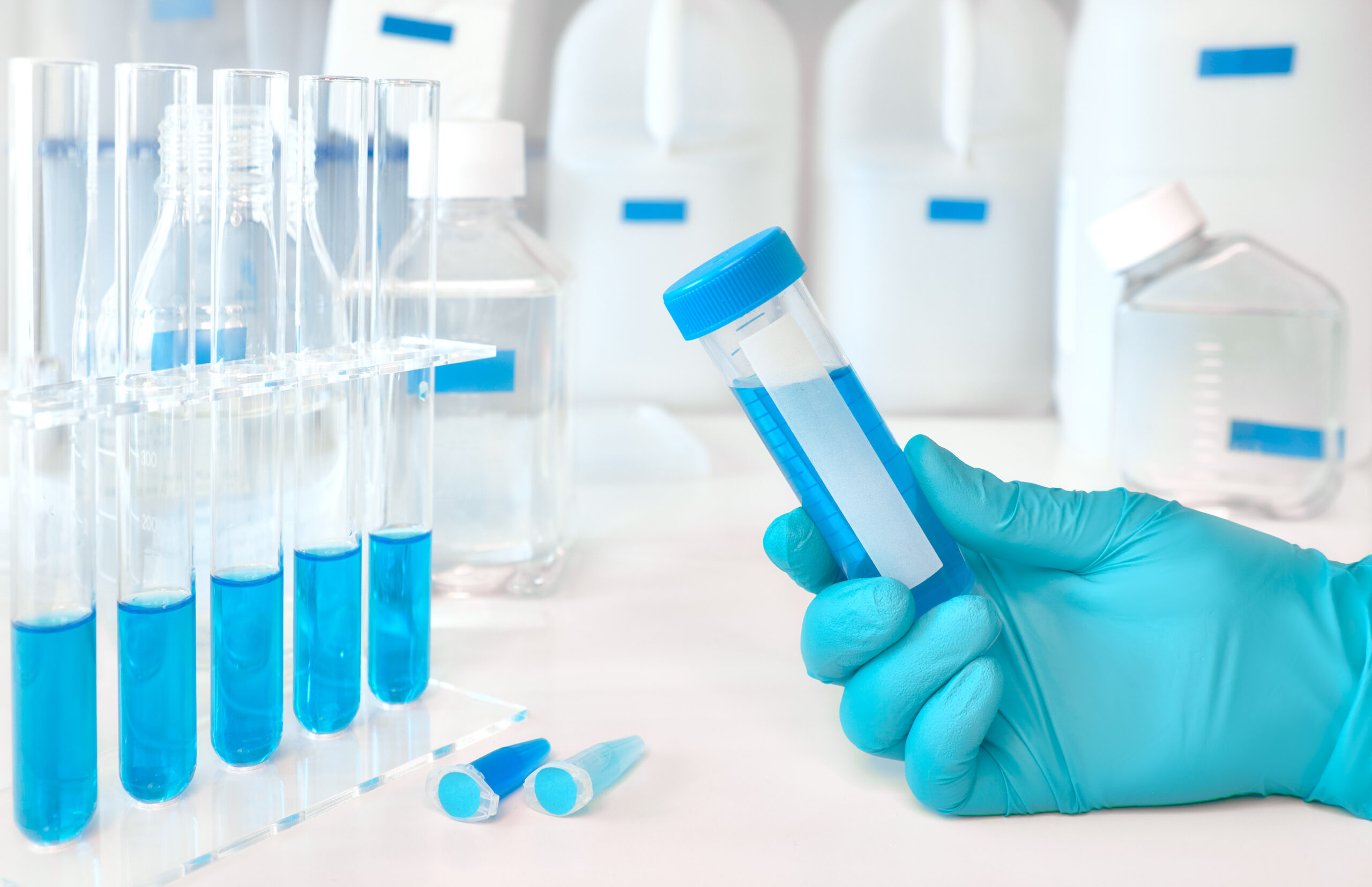 Lab worker holding test tube