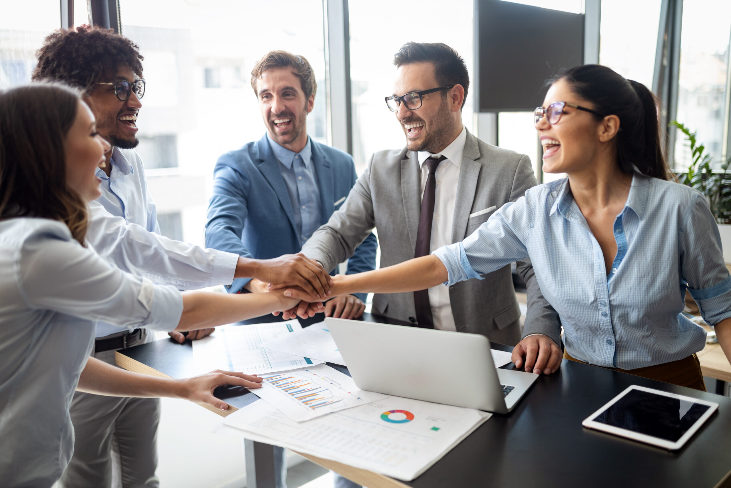 A group of people celebrate at work