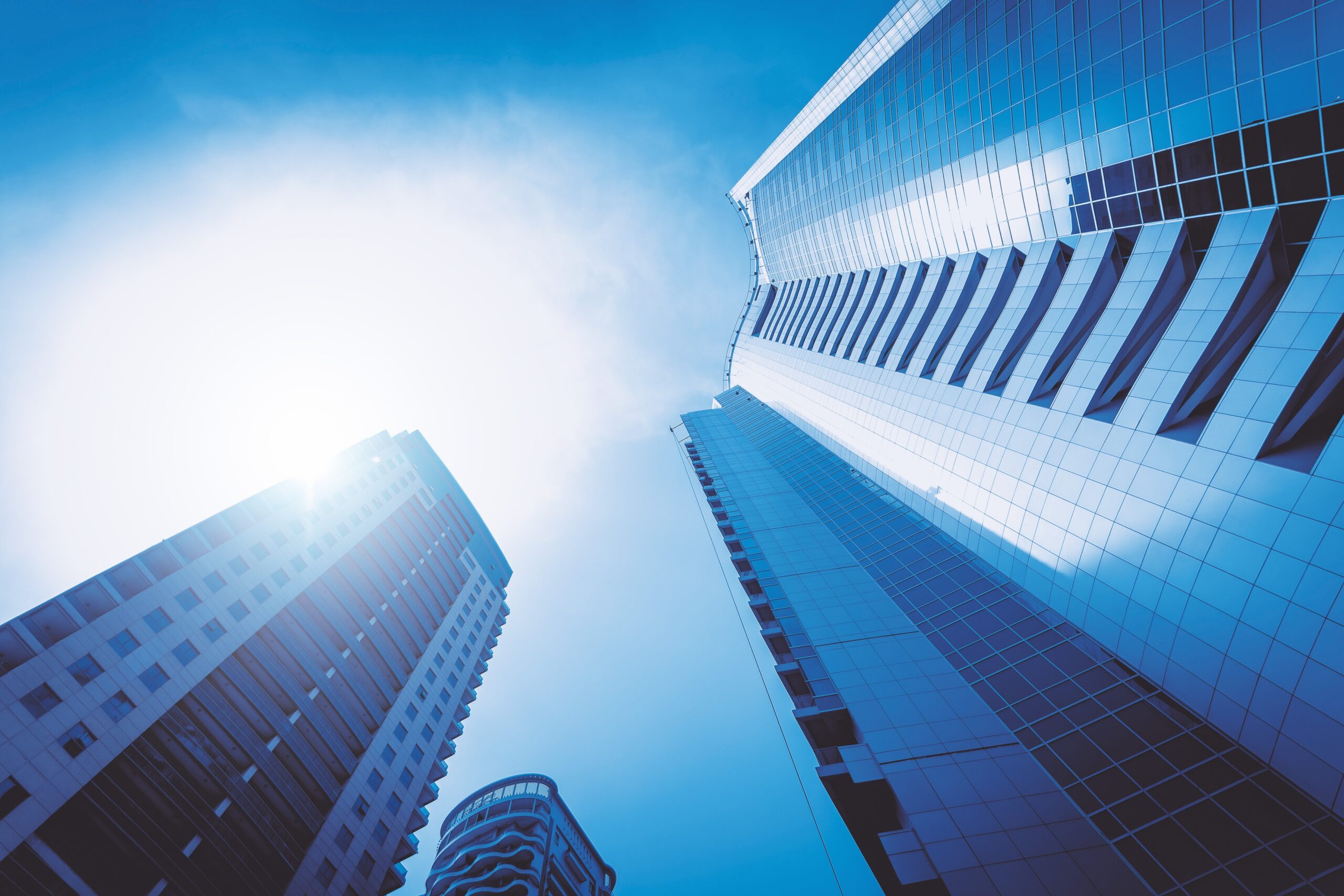 High rise buildings against blue sky